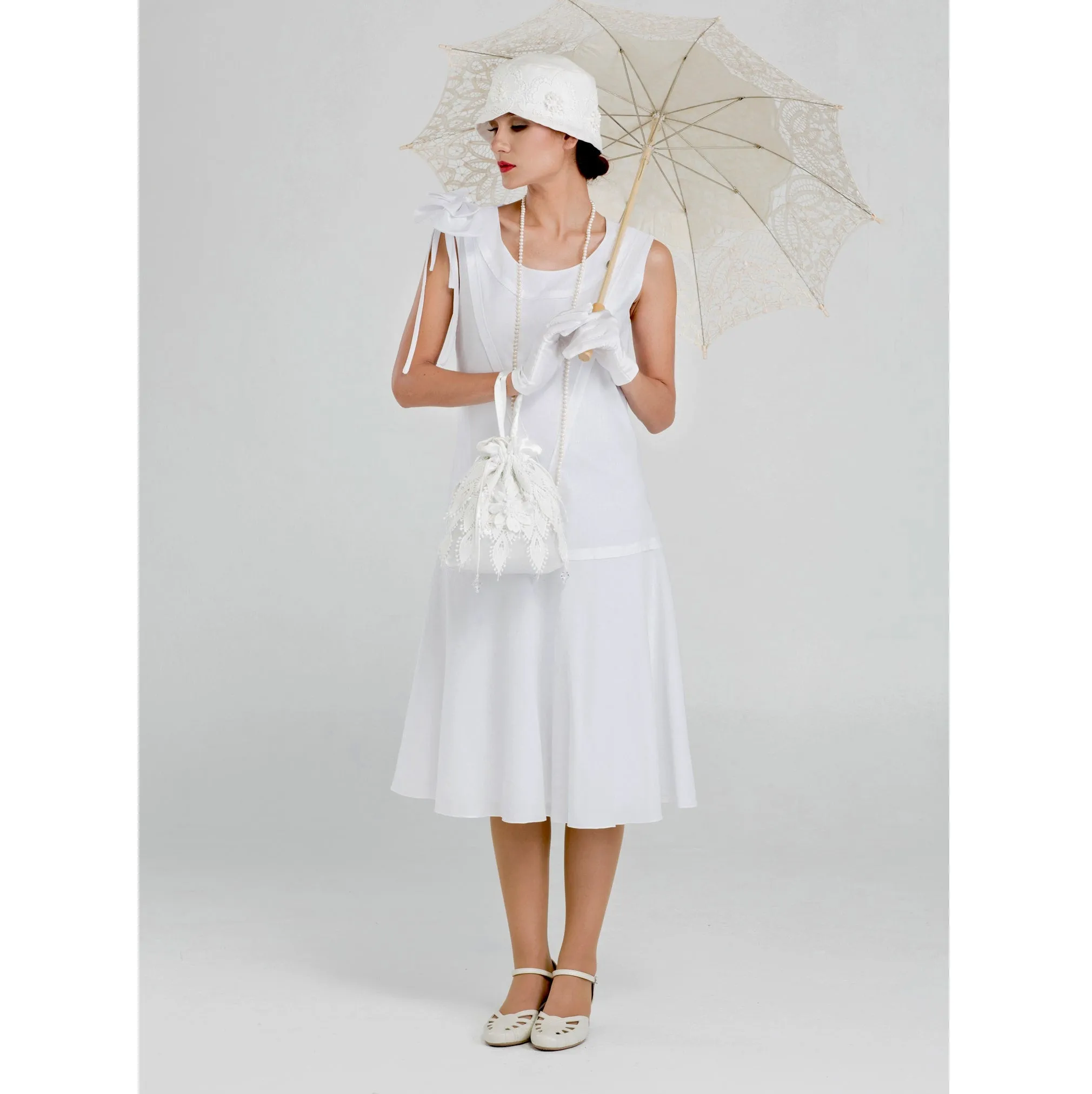 1920s high tea dress in white cotton with bow on shoulder
