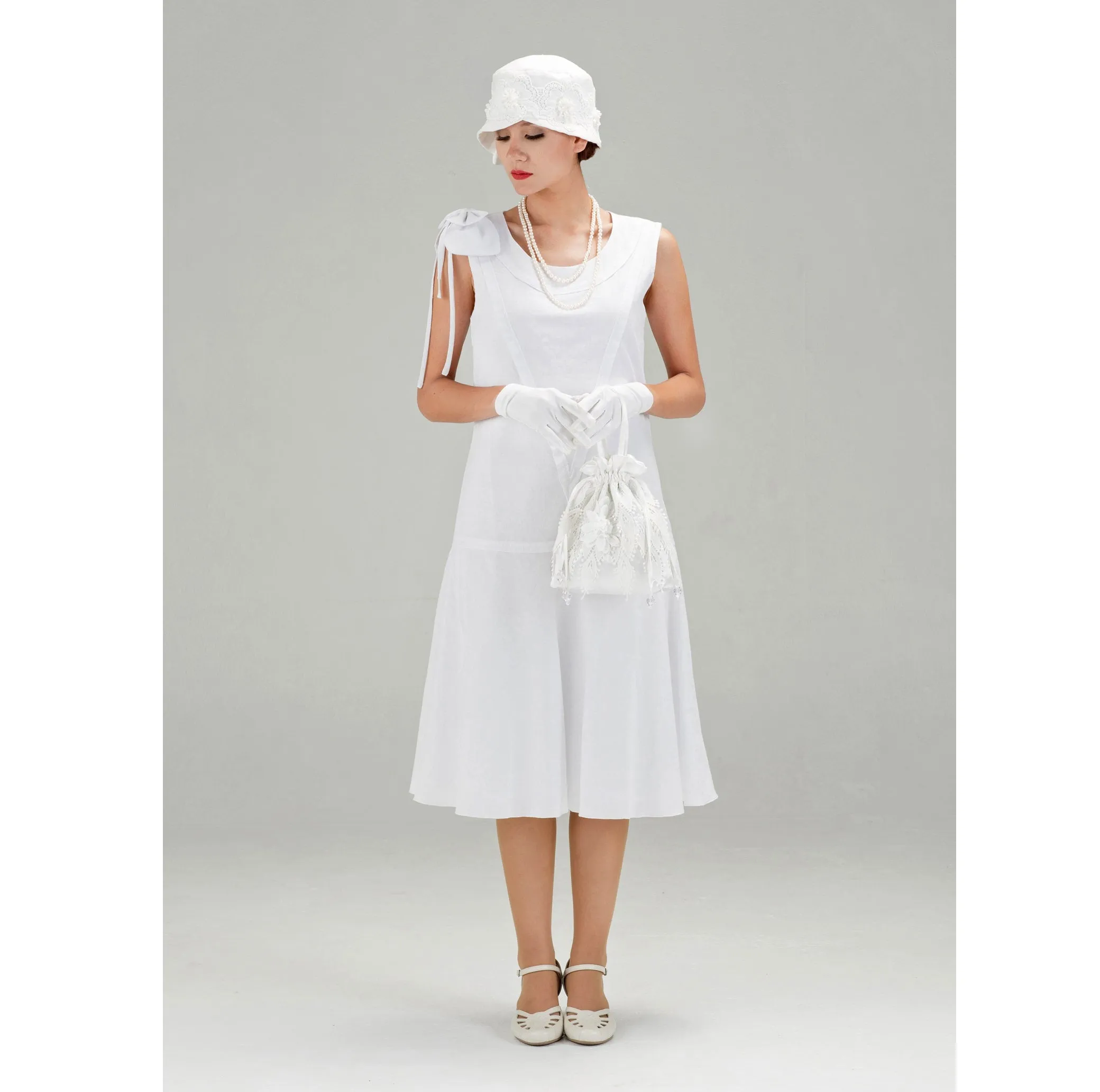 1920s high tea dress in white cotton with bow on shoulder