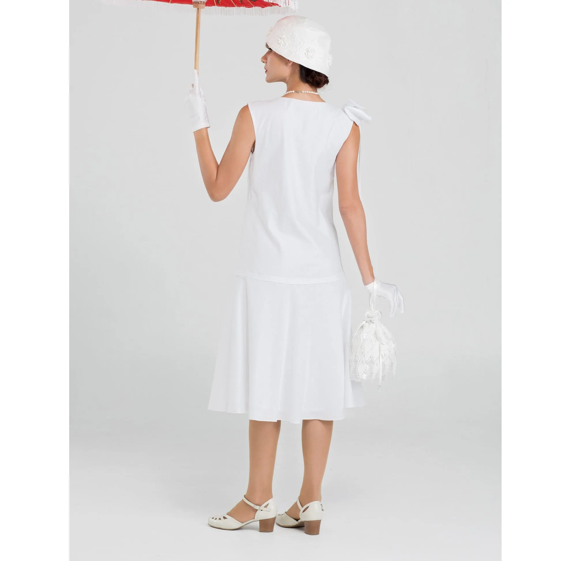 1920s high tea dress in white cotton with bow on shoulder