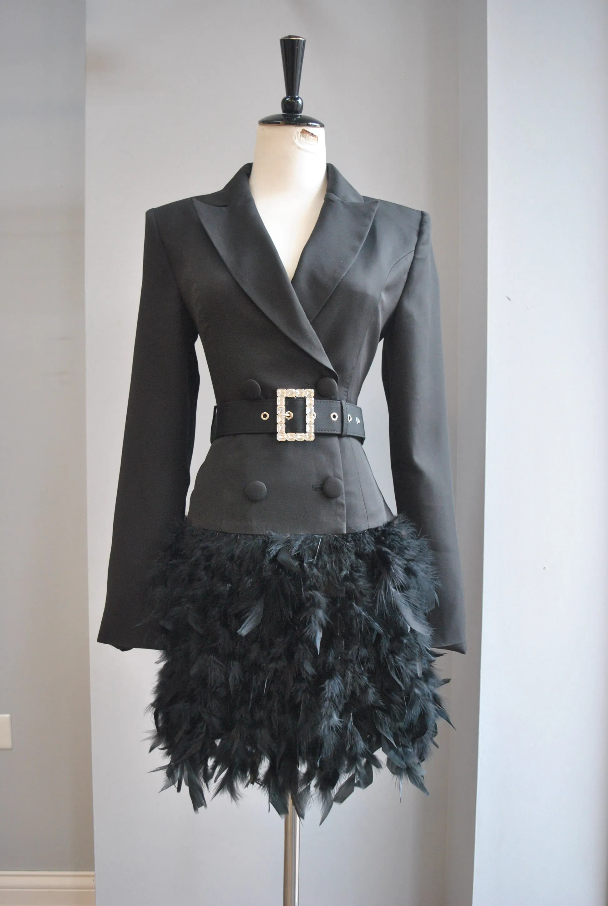 BLACK JACKET DRESS WITH A CRYSTAL BELT AND FEATHERS