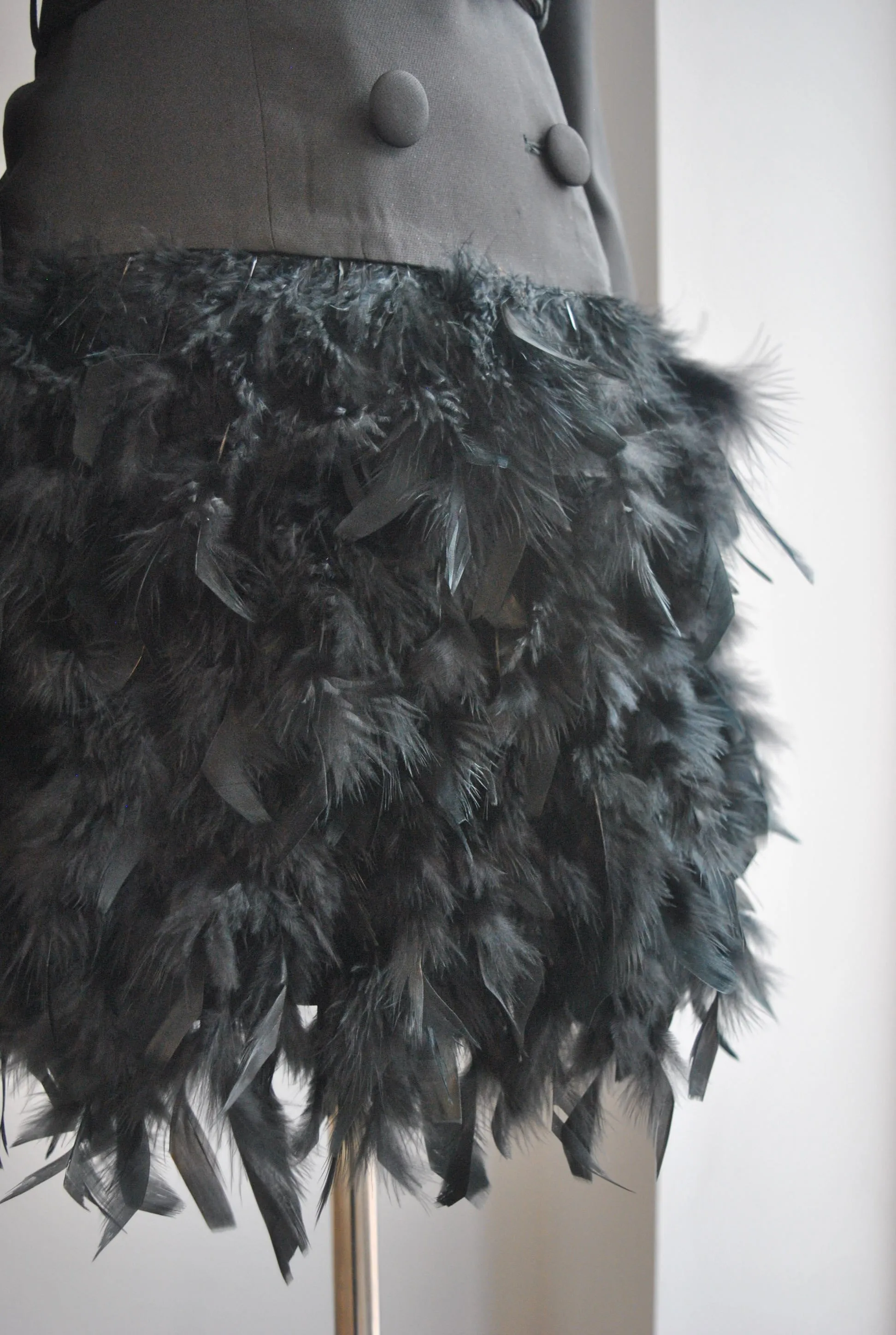 BLACK JACKET DRESS WITH A CRYSTAL BELT AND FEATHERS