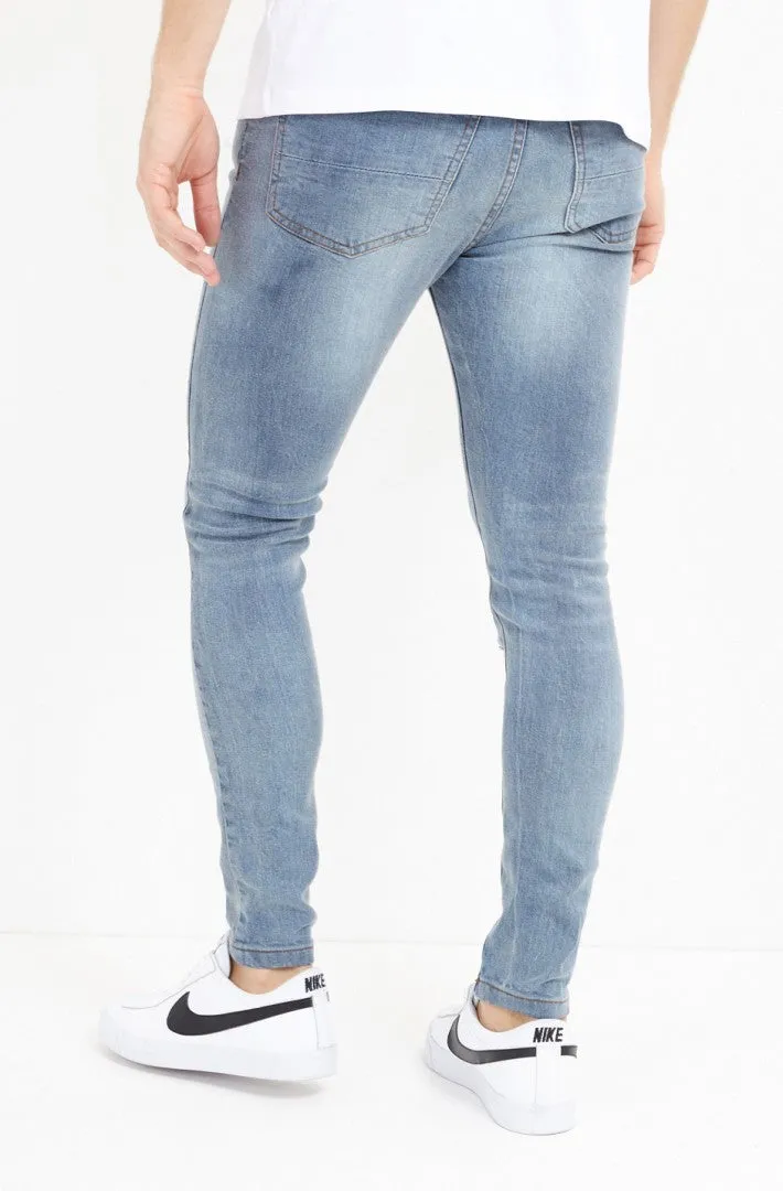 SKINNY FIT MID BLUE WASH RIPPED JEANS