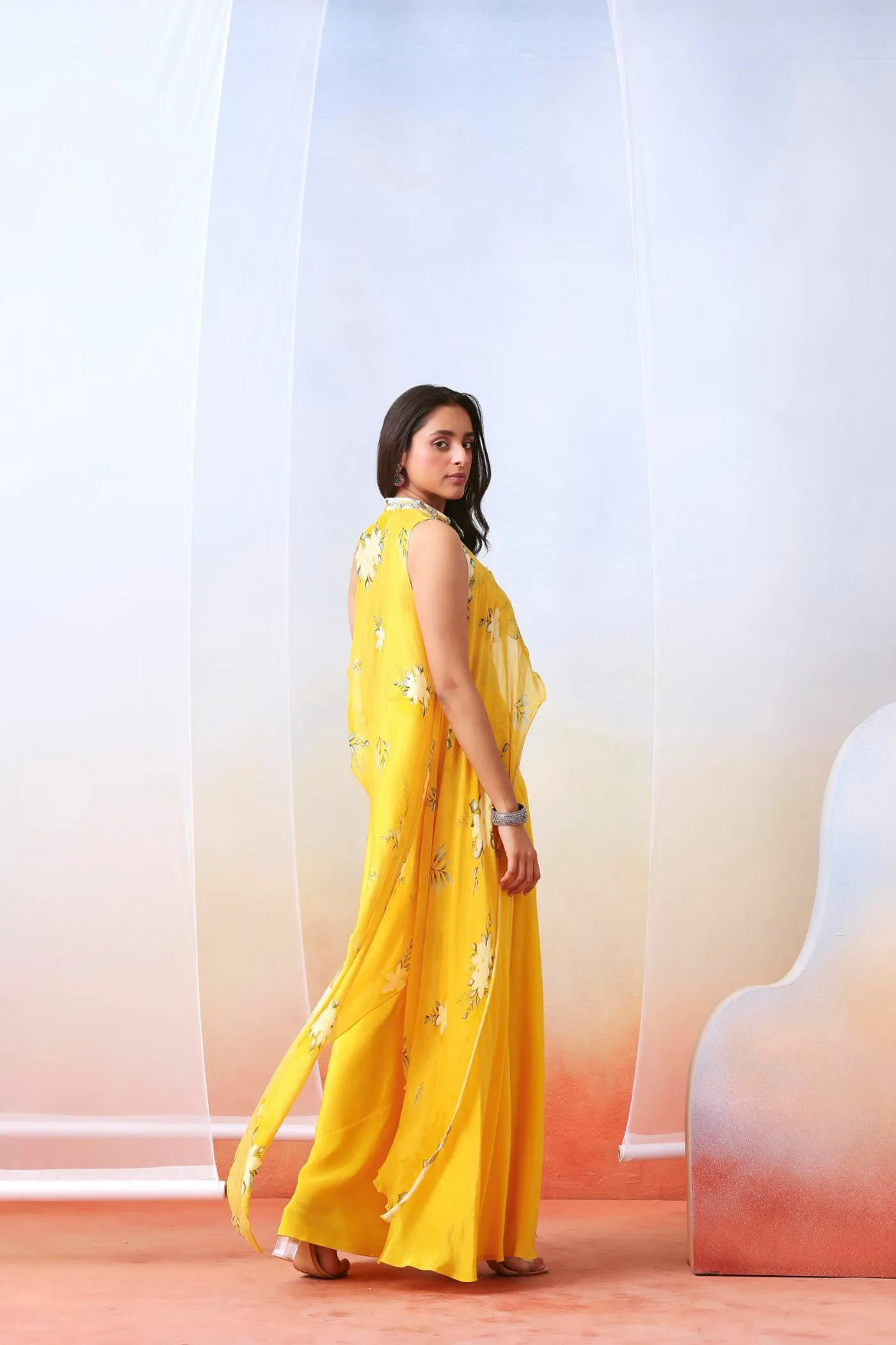 Yellow printed sharara set with embroidered  drape cape