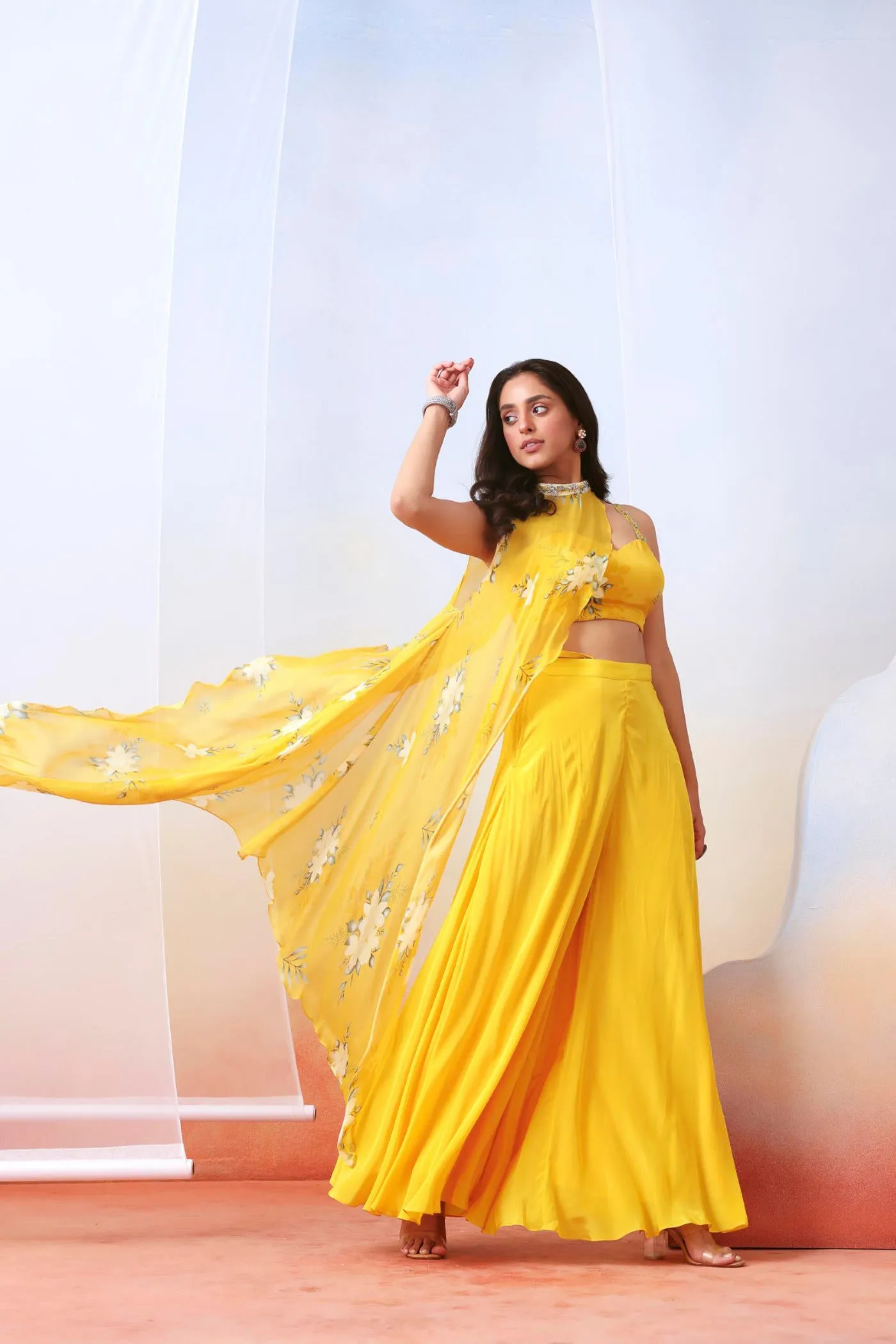 Yellow printed sharara set with embroidered  drape cape